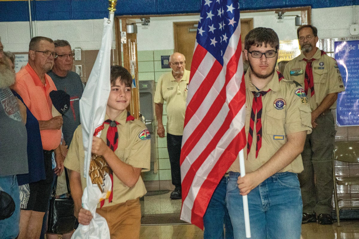 Boy Scouts carrying flags