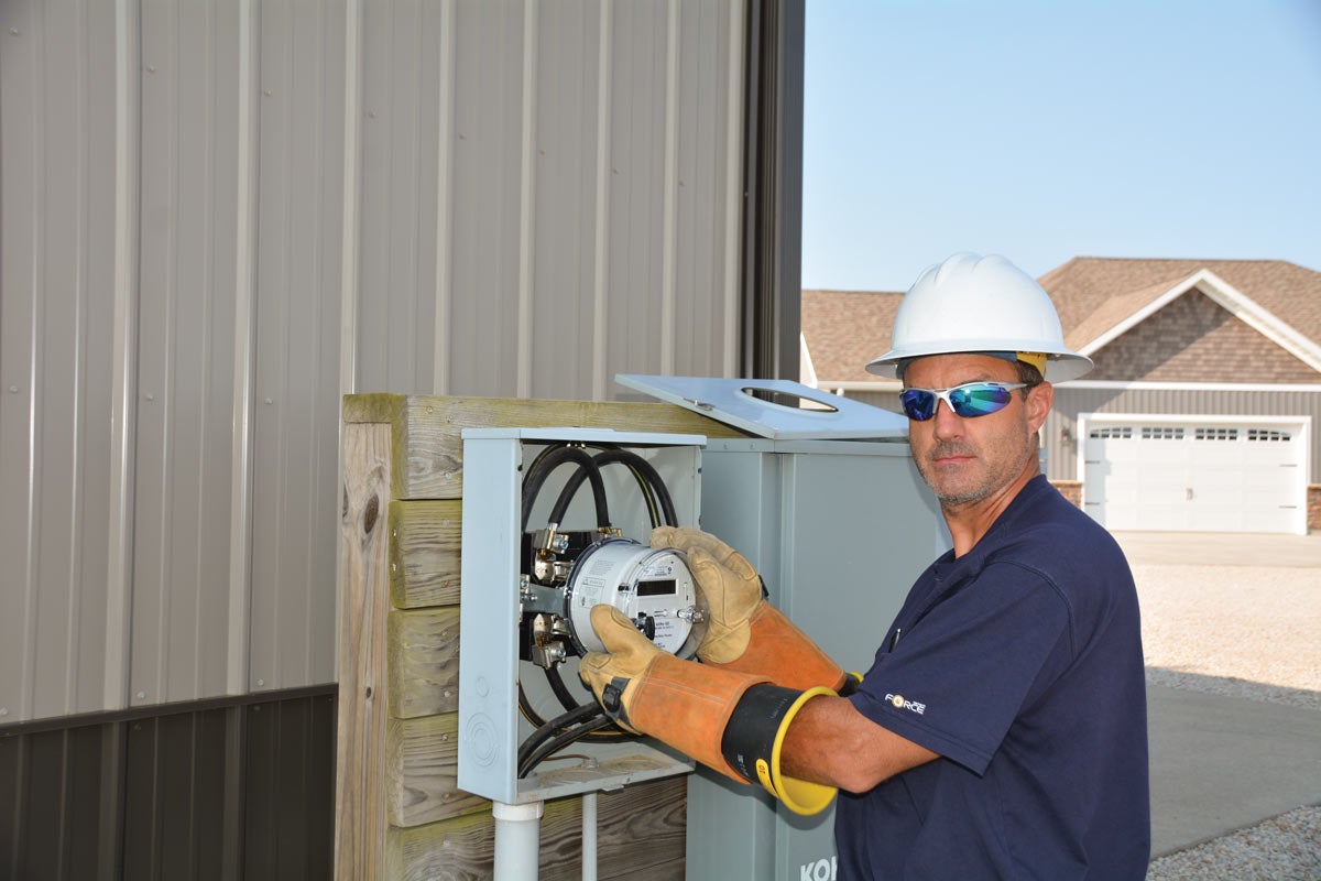 EnerStar has started beta testing the new meters that will be installed at all account locations over the next year. Here, EnerStar’s Chad Cornwell switches one of the first meters deployed. The current electric meters in use were installed in 2010.